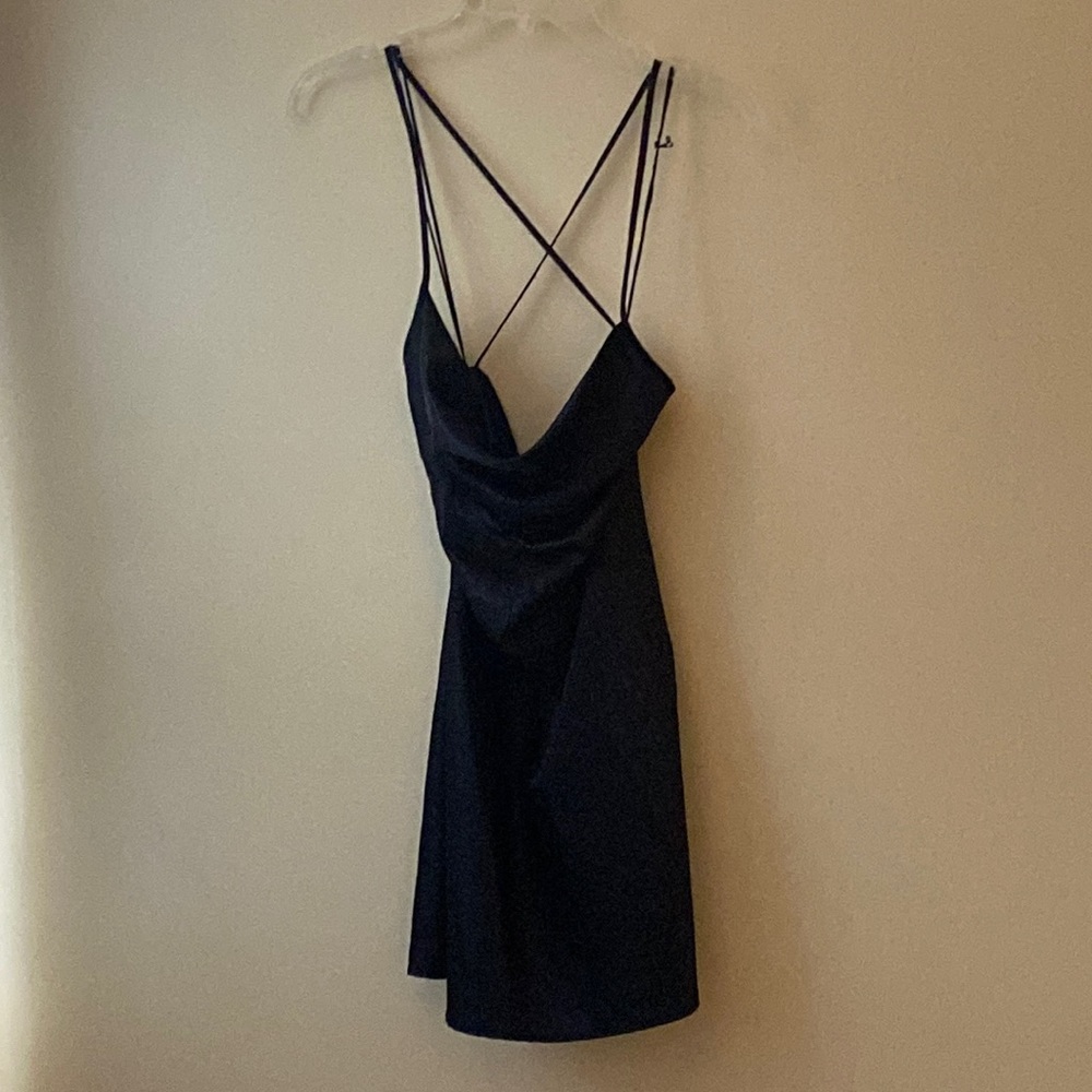 Black mini, silk, crossover dress with an open back